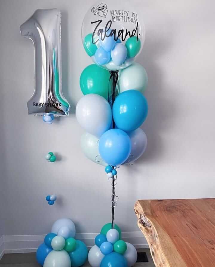 blue ,white and green balloons with numbered foil balloon for birthday