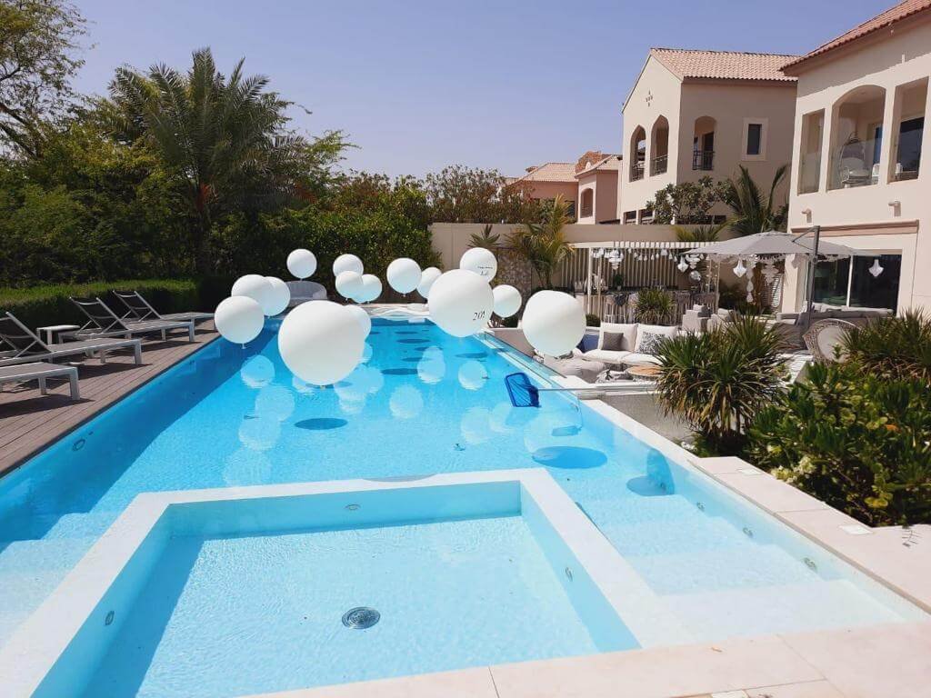white themed pool balloons for decoration