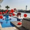 red color themed pool balloons for decorations