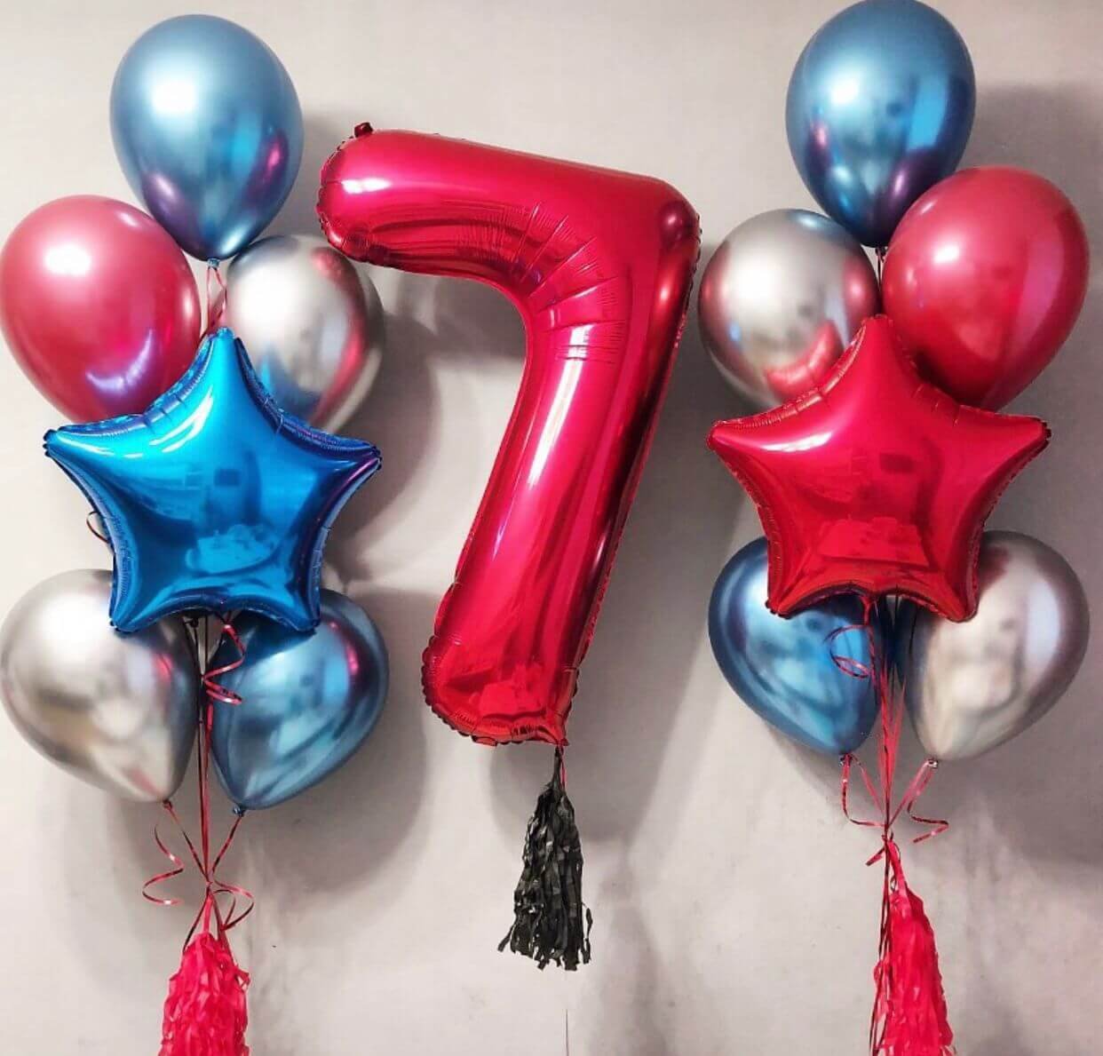 multicolored balloons with star and numbered foil balloons